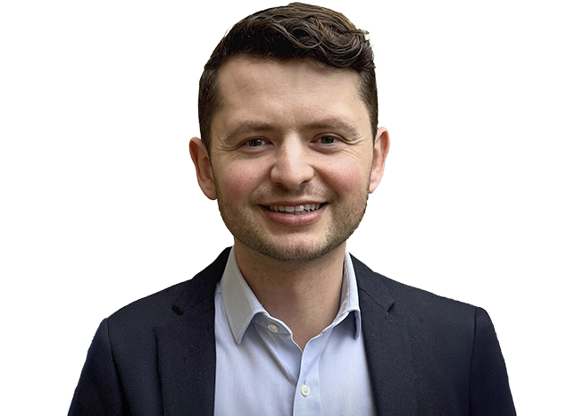 Person wearing suit smiling