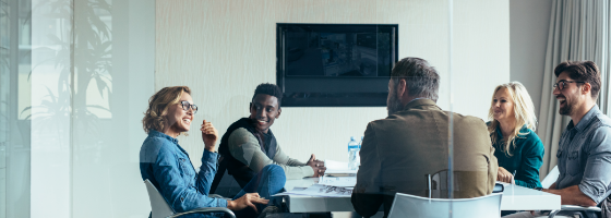 5 people having a meeting about monitorships