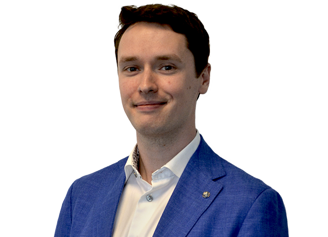 Person in suit smiling at camers