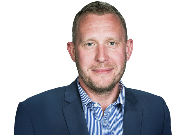 Man wearing blue collared shirt with suit jacket