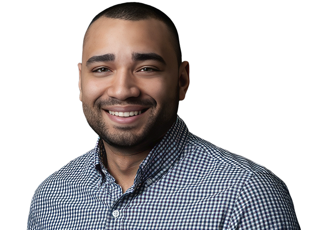 Man smiling, wearing a checkered shirt
