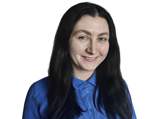 Person with blue shirt smiling for photo