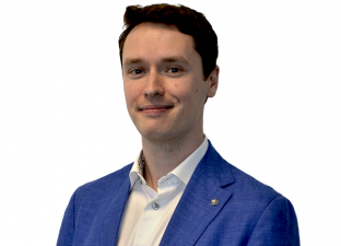 Person in suit smiling at camers