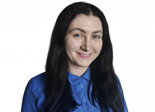 Person with blue shirt smiling for photo