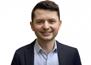 Person wearing suit smiling